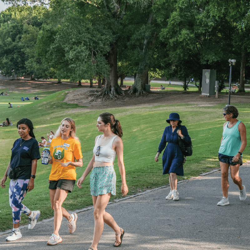 WebsiteBlogBanner-2 Community members walking together through Piedmont Park on a sunny day